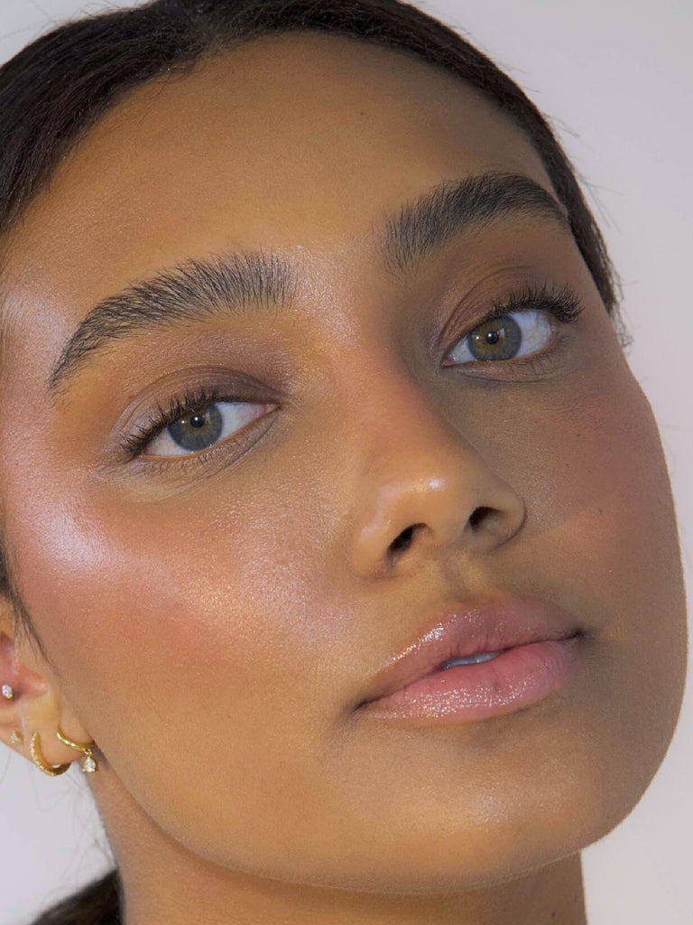 close up of model wearing blush & PROTECT SPF 50+